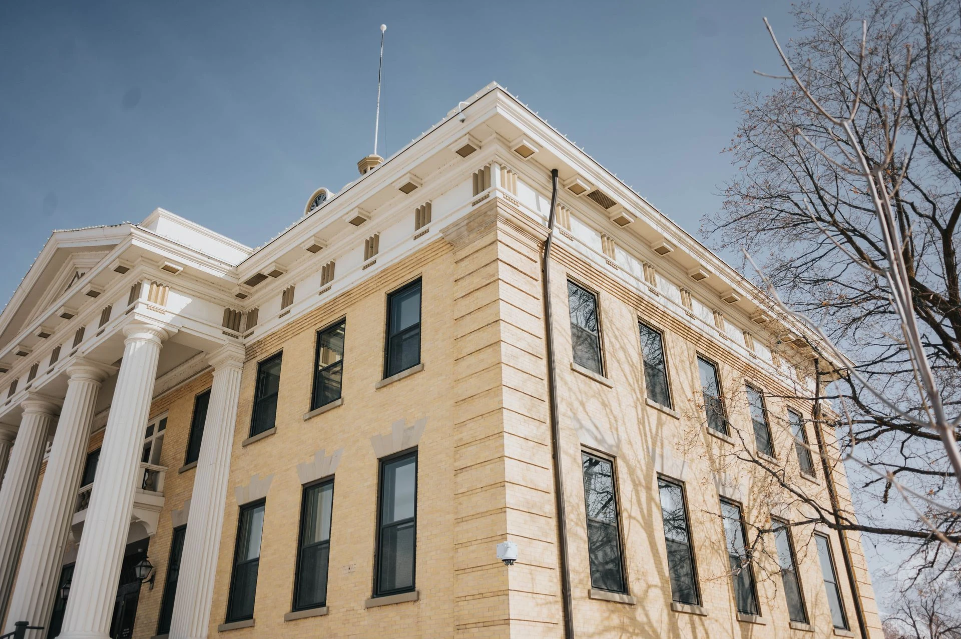 Corner view of a classical courthouse building with columns