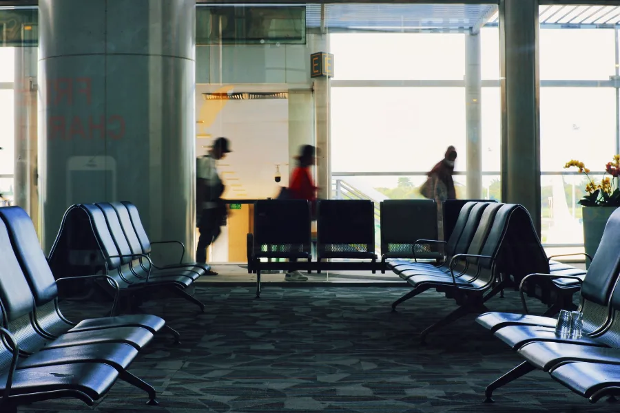 Empty rows of seats at an airport departure gate