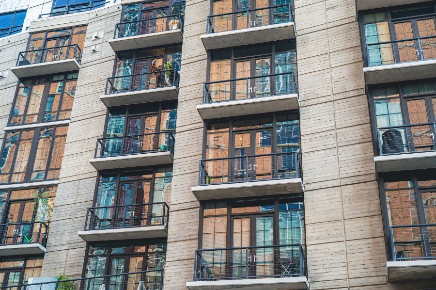 Facade of an apartment building with rows of balconies