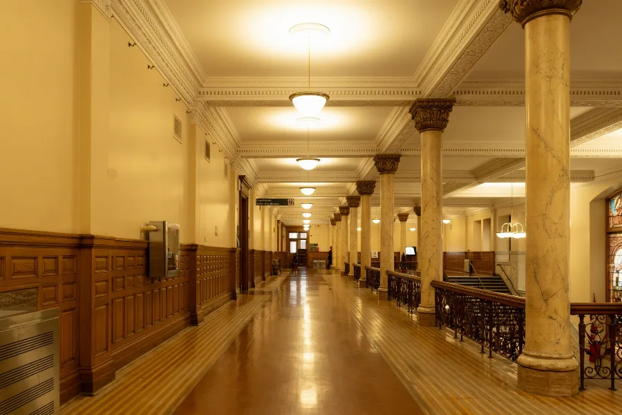 Long columned corridor inside a courthouse building